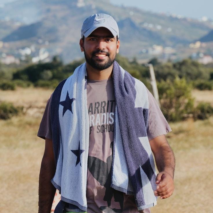 Kaveri Mehta, Lead Design Curator at MistGroveHarbor, reviewing corporate floral arrangements